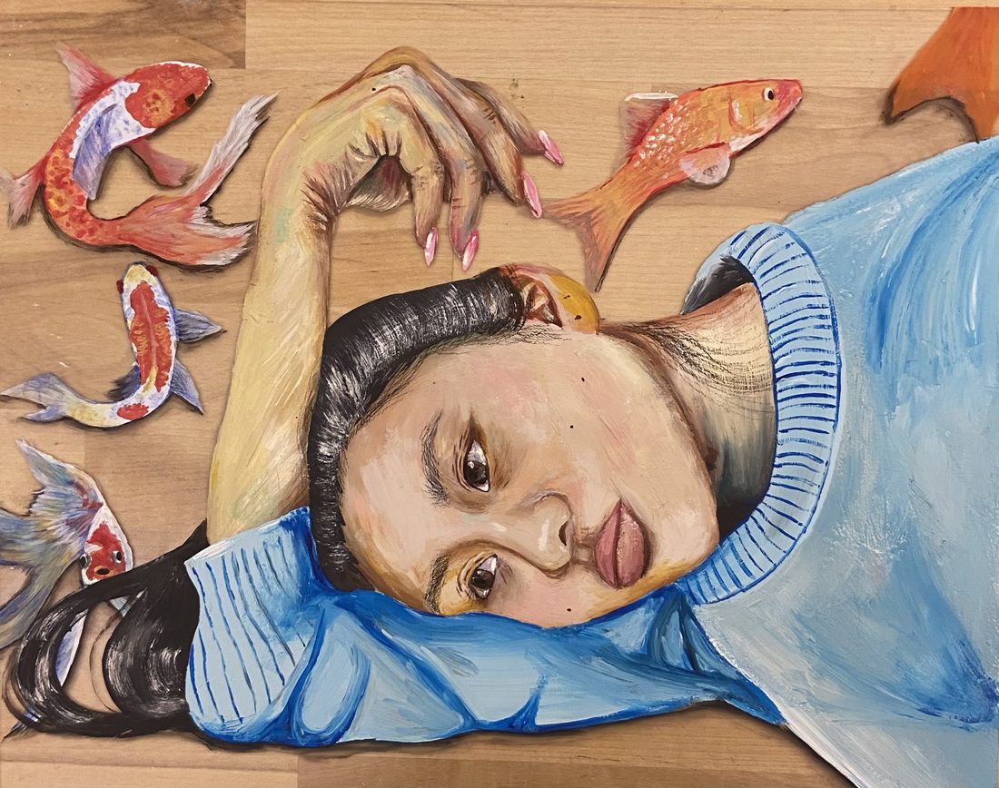 A girl lying on a wooden floor surrounded by koi fish